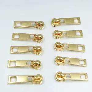 extrator de zíper de metal dourado