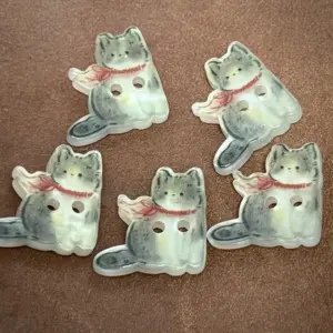 botões gato vermelho