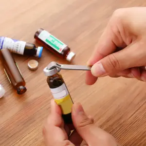 abridor de frasco líquido oral
